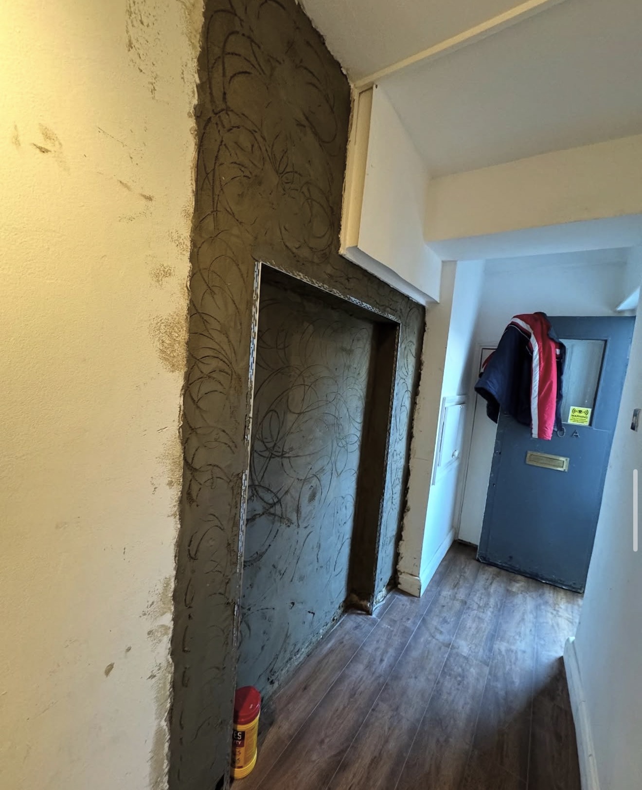 Hallway plastering in progress